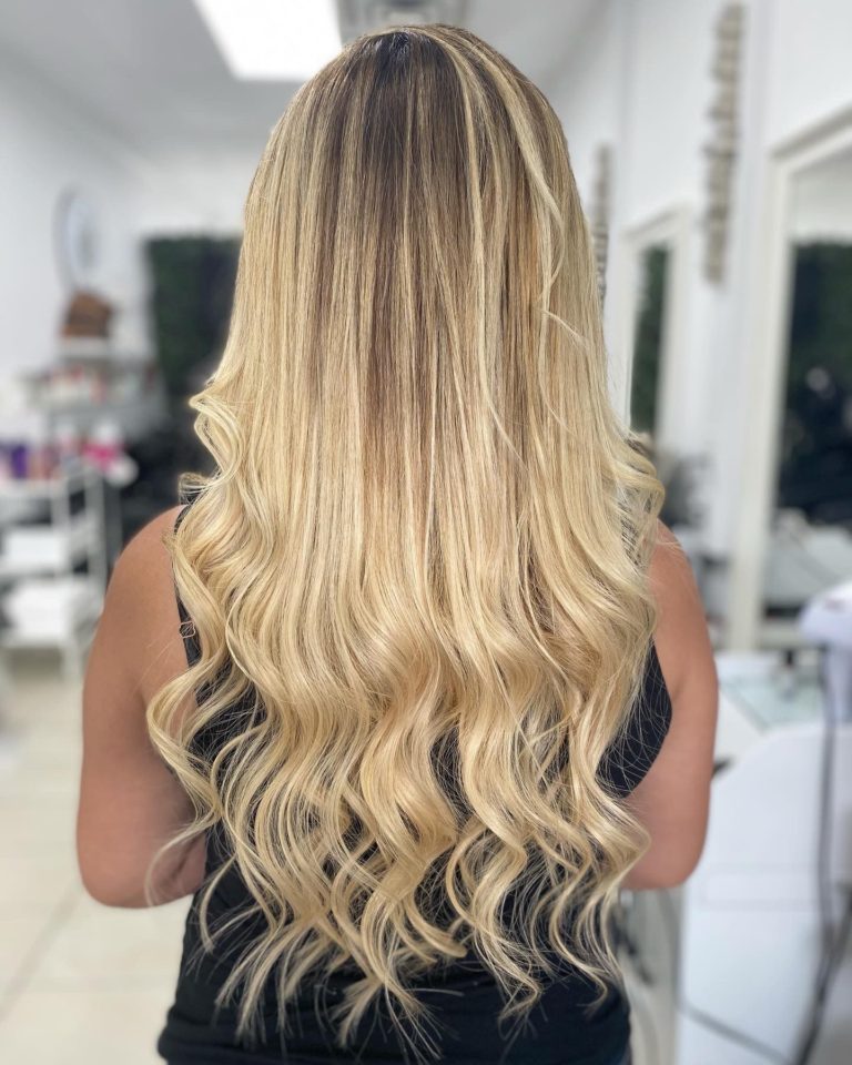 Golden blonde balayage with long hair extensions by Donya