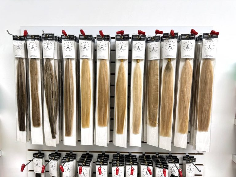 Wall of hand-blended 100% human Remy hair extension shades at Donya Hair + Body in Richmond Hill
