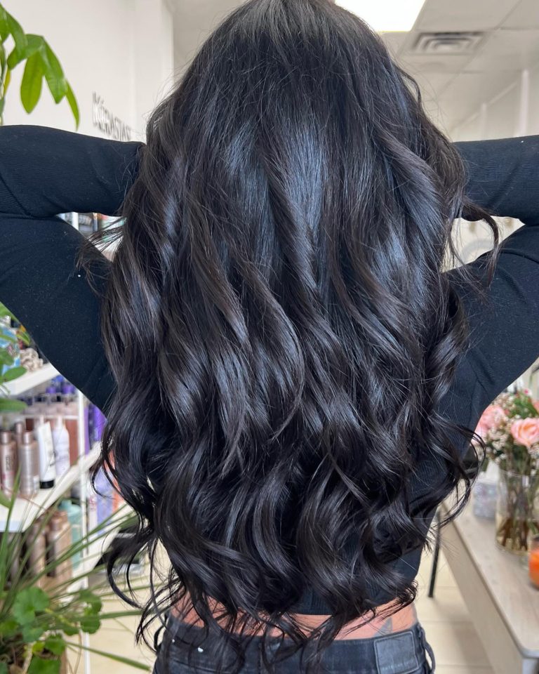 Long platinum blonde hair extensions with soft waves at Donya Hair + Body, Richmond Hill