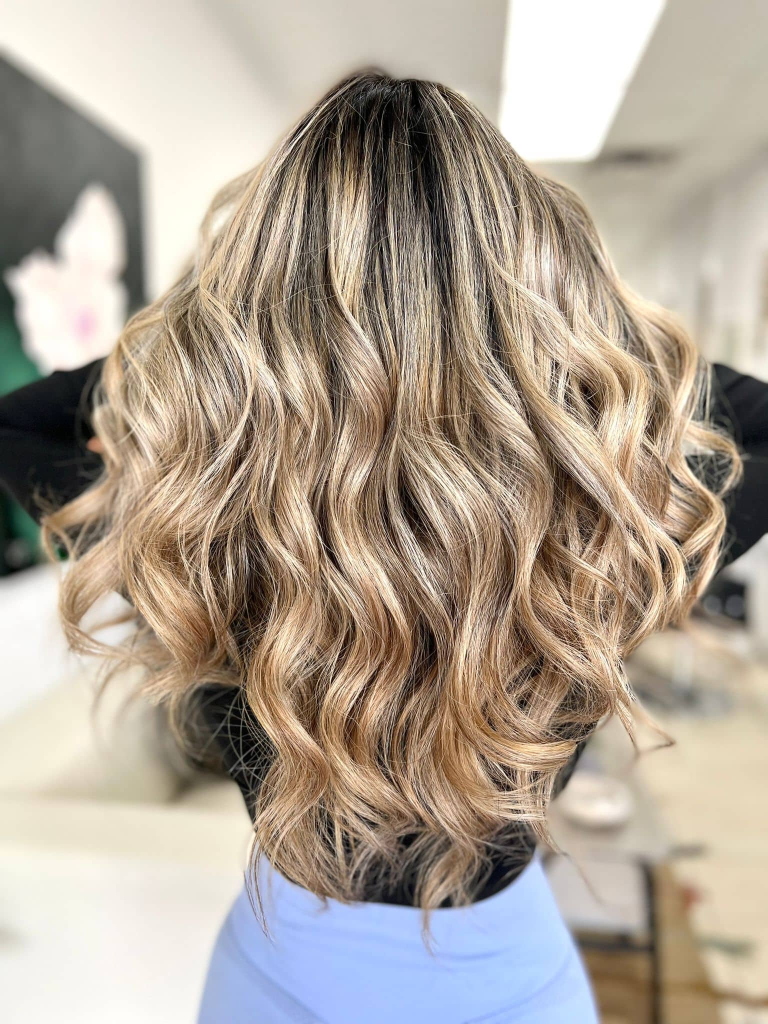 Rooted champagne honey blonde balayage by Donya at Donya Hair + Body, the best balayage in Richmond Hill